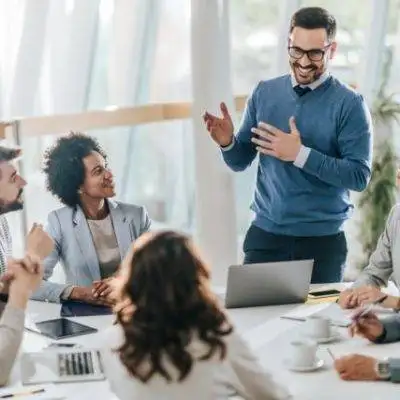 happy-manager-leads-a-meeting-in-the-office-640x427